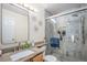 Updated bathroom with granite countertop, large mirror and tiled shower at 19681 E 59Th Pl, Aurora, CO 80019