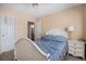 Cozy bedroom featuring a comfortable bed, matching nightstand, and an ensuite bathroom at 19681 E 59Th Pl, Aurora, CO 80019