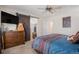Spacious bedroom featuring a barn door, comfortable furnishings, and ample natural light, creating a relaxing atmosphere at 19681 E 59Th Pl, Aurora, CO 80019