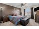 Comfortable bedroom featuring a ceiling fan, a large window with natural light, and neutral decor at 19681 E 59Th Pl, Aurora, CO 80019