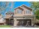 Charming two-story home with a brick-accented garage and well-maintained landscaping at 19681 E 59Th Pl, Aurora, CO 80019
