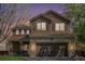 Charming two-story home with a brick-accented garage and well-maintained landscaping at 19681 E 59Th Pl, Aurora, CO 80019