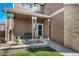 Inviting front entrance with a cozy porch and well-manicured flower bed at 19681 E 59Th Pl, Aurora, CO 80019