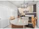 Open-concept kitchen featuring a large island with granite countertops and decorative lighting, offering a stylish entertaining space at 19681 E 59Th Pl, Aurora, CO 80019