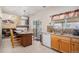 Well-lit kitchen with an island, sleek countertops, and stainless steel appliances at 19681 E 59Th Pl, Aurora, CO 80019