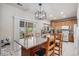 Modern kitchen with an island, stainless steel appliances, and sliding door access to outdoors at 19681 E 59Th Pl, Aurora, CO 80019