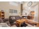 Inviting living room with high ceilings, comfortable seating, and an open layout at 19681 E 59Th Pl, Aurora, CO 80019