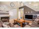 Spacious living room featuring high ceilings, a fireplace, and comfortable seating at 19681 E 59Th Pl, Aurora, CO 80019