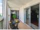 Relax on this bright balcony with sleek tile and wrought iron furniture at 3465 S Poplar St # 506, Denver, CO 80224