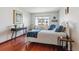 Cozy bedroom with large window and stylish decor at 3465 S Poplar St # 506, Denver, CO 80224