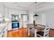 Bright kitchen with white cabinets and stainless steel appliances at 3465 S Poplar St # 506, Denver, CO 80224