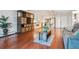 Open concept living and kitchen area with hardwood floors at 3465 S Poplar St # 506, Denver, CO 80224