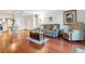 Open living space with hardwood floors and access to kitchen and bedrooms at 3465 S Poplar St # 506, Denver, CO 80224