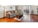 Inviting living room with rich flooring and access to a private balcony at 3465 S Poplar St # 506, Denver, CO 80224