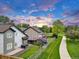 Aerial view of backyards with manicured lawns, wooden fences, and neighborhood path at 4112 Brandon Ave, Broomfield, CO 80020