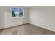 Carpeted bedroom with a large window providing a view of the neighborhood at 4112 Brandon Ave, Broomfield, CO 80020