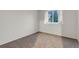 A bright bedroom with a large window and neutral carpet at 4112 Brandon Ave, Broomfield, CO 80020