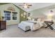 Bright bedroom featuring neutral walls, natural light, and cozy furnishings at 4112 Brandon Ave, Broomfield, CO 80020