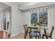 Cozy breakfast nook bathed in natural light from the large window with backyard views at 4112 Brandon Ave, Broomfield, CO 80020