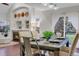 Dining area featuring a modern fireplace, sleek lighting, and sliding glass doors to outdoor area at 4112 Brandon Ave, Broomfield, CO 80020