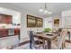 Formal dining room with elegant table setting, modern lighting, and kitchen access at 4112 Brandon Ave, Broomfield, CO 80020