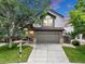 Charming two-story home with a well-maintained lawn and attached two-car garage, set against a colorful evening sky at 4112 Brandon Ave, Broomfield, CO 80020