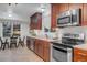 Well-lit kitchen and dining nook featuring stainless steel appliances and outdoor views at 4112 Brandon Ave, Broomfield, CO 80020