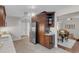 Spacious kitchen with stainless steel appliances and hardwood floors seamlessly connected to dining area at 4112 Brandon Ave, Broomfield, CO 80020