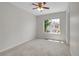 Spacious bedroom featuring a ceiling fan and a bright window offering ample natural light at 1288 S Beeler Ct, Denver, CO 80247