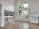 Bright dining room with modern light fixture and large windows with lush greenery views at 1288 S Beeler Ct, Denver, CO 80247