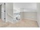 Bright upstairs hallway with railing overlooking the lower level at 1288 S Beeler Ct, Denver, CO 80247