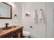 Stylish bathroom with a copper sink, modern fixtures, and a tiled shower at 3260 47Th St # 205A, Boulder, CO 80301