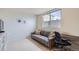 Small office or bedroom featuring a gray couch and built in desk at 3260 47Th St # 205A, Boulder, CO 80301