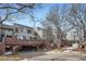 Condominium building with brick accents, covered parking, and mature trees at 3260 47Th St # 205A, Boulder, CO 80301