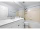 Bathroom featuring a tub with shower, white vanity with countertop, mirror, and tile accents at 19410 E Ithaca Pl, Aurora, CO 80013