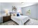 Bright bedroom with a large bed, stylish decor, and a window providing natural light at 19410 E Ithaca Pl, Aurora, CO 80013