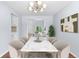 Elegant dining room featuring modern lighting, marble table, and stylish decor at 19410 E Ithaca Pl, Aurora, CO 80013