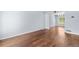 Open-concept living room with hardwood floors and neutral paint; great for entertaining at 19410 E Ithaca Pl, Aurora, CO 80013