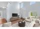 Inviting living room with natural light, showcasing staircase and neutral color palette at 19410 E Ithaca Pl, Aurora, CO 80013