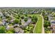 Picturesque neighborhood featuring well-maintained homes, lush trees, and a greenbelt at 19410 E Ithaca Pl, Aurora, CO 80013