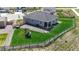 Backyard features a wooden fence, lush lawn, patio, and play set, creating a Gathering-friendly outdoor space at 13488 Wabash St, Thornton, CO 80602