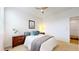 Cozy bedroom featuring a queen-size bed with soft linens, bedside tables, and a window at 13488 Wabash St, Thornton, CO 80602