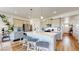 Modern kitchen with gray cabinets, stainless steel appliances, and a large island at 13488 Wabash St, Thornton, CO 80602