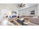 A modern living room design with a cozy fireplace and stylish decor at 13488 Wabash St, Thornton, CO 80602