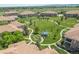 Scenic aerial view of the community featuring lush green spaces and walking paths with a gazebo at 6292 Kilmer Loop # 201, Golden, CO 80403