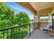 Private balcony with lush green space views at 6292 Kilmer Loop # 201, Golden, CO 80403