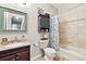 Traditional bathroom with tiled shower, vanity and blue accents at 6292 Kilmer Loop # 201, Golden, CO 80403
