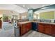 Modern kitchen with cherry wood cabinets, countertops, stainless steel appliances, and ample counter space at 6292 Kilmer Loop # 201, Golden, CO 80403