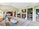 Inviting living room with a fireplace, built-in shelves, and a view to the adjacent kitchen at 6292 Kilmer Loop # 201, Golden, CO 80403