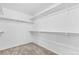 Walk-in closet with ample shelving and storage space, offering organization and convenience at 10933 E 115Th Pl, Commerce City, CO 80640